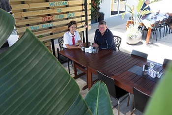 Photo of Debbie and Mark Ahern in the alfresco area of Deb"s Fish Cafe