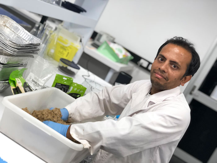 photo of Reaz Chaklader preparing aquafeed ingredients
