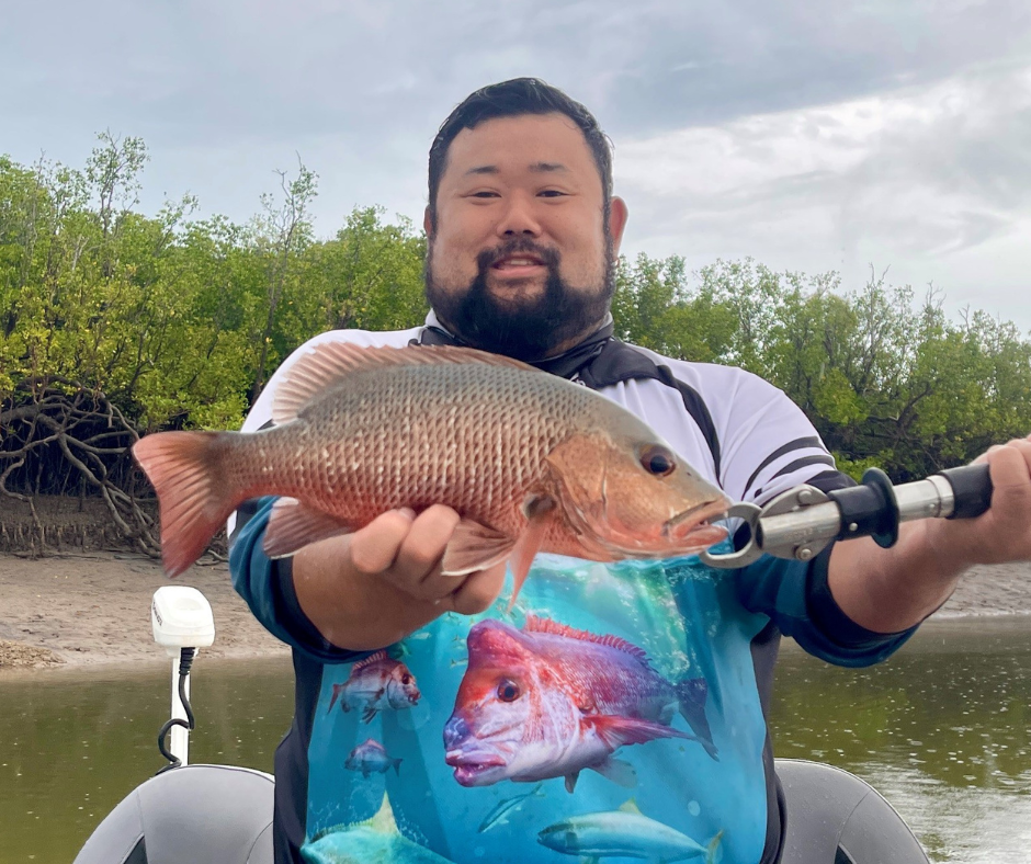 Pictured: Yuki, a recreational fisher who contributed to the project, holding a Mangrove Jack. 
