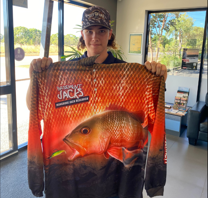 Pictured:  Fisher winning his Basement Jacks fishing shirt Merchandise, after donating Mangrove jack frames to the project 