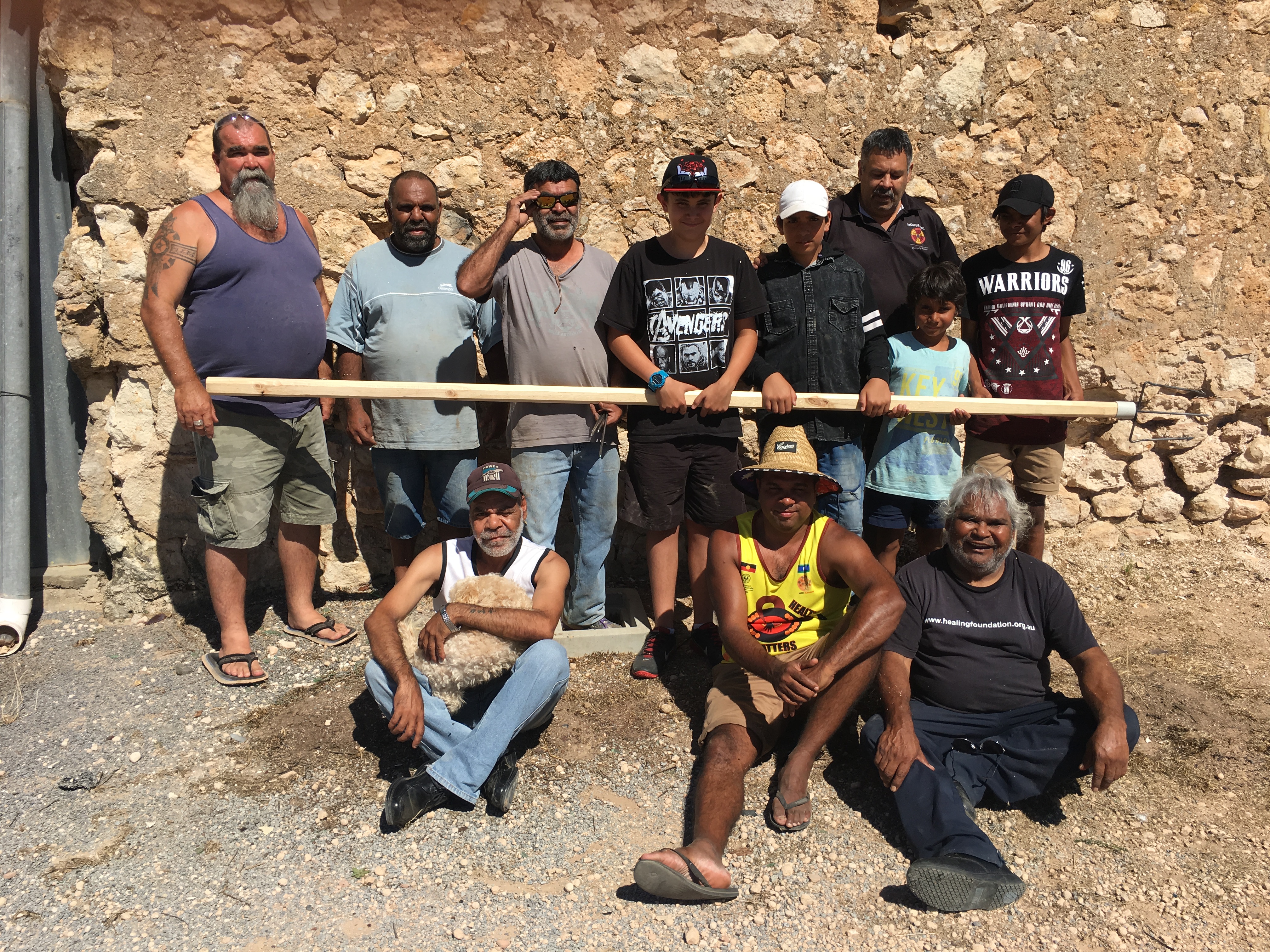 Narurunga men and boys standing with traditional spear used to hunt Gynburra