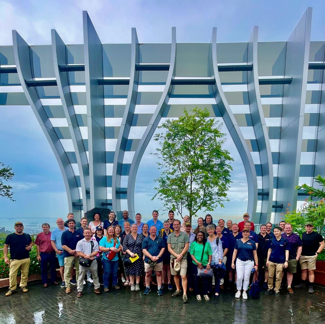 Joana Mendes and Nuffield scholars posing in front of Singapore ANZ's headquarters