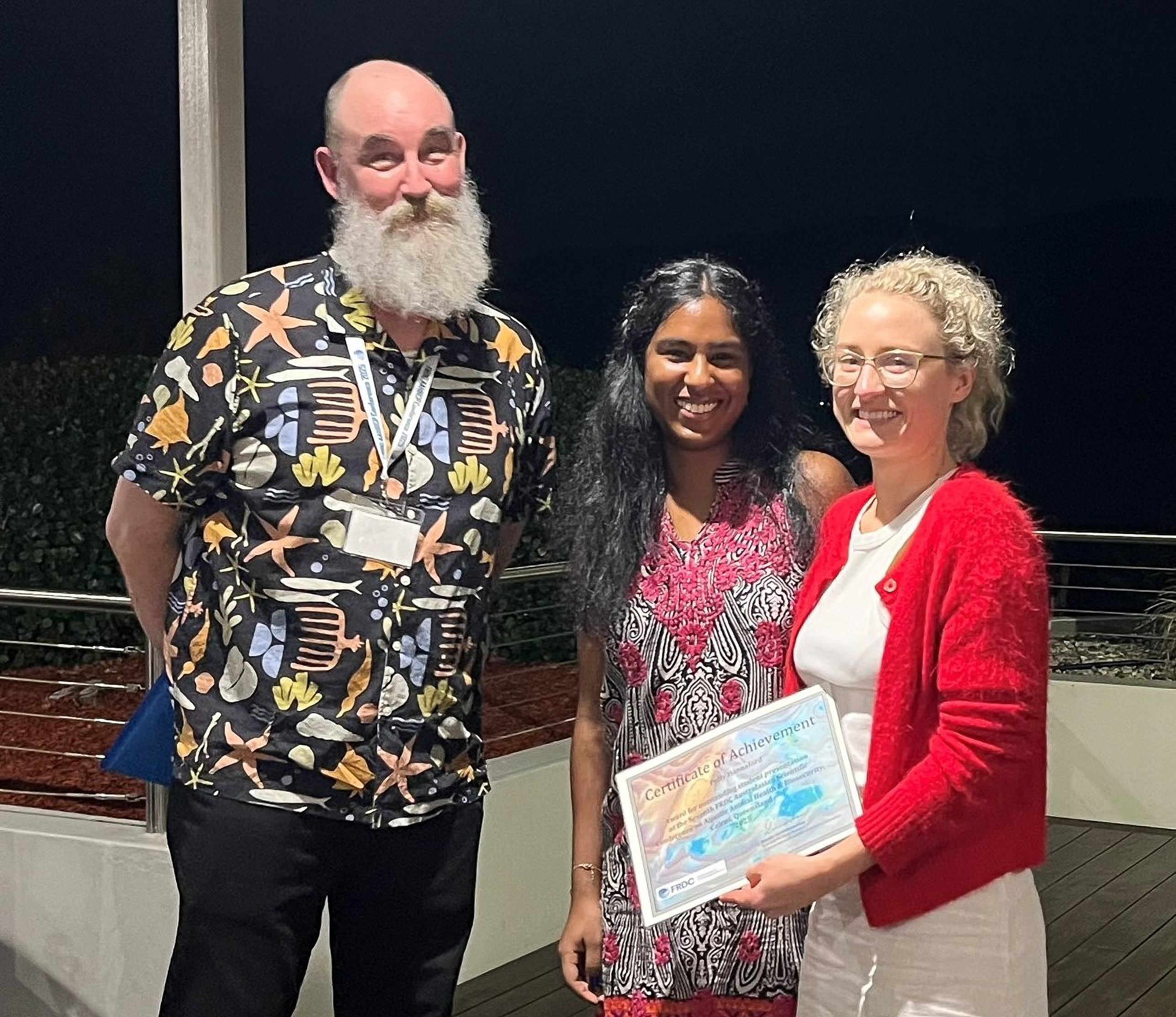 Middle Aged man and two young woman smiling