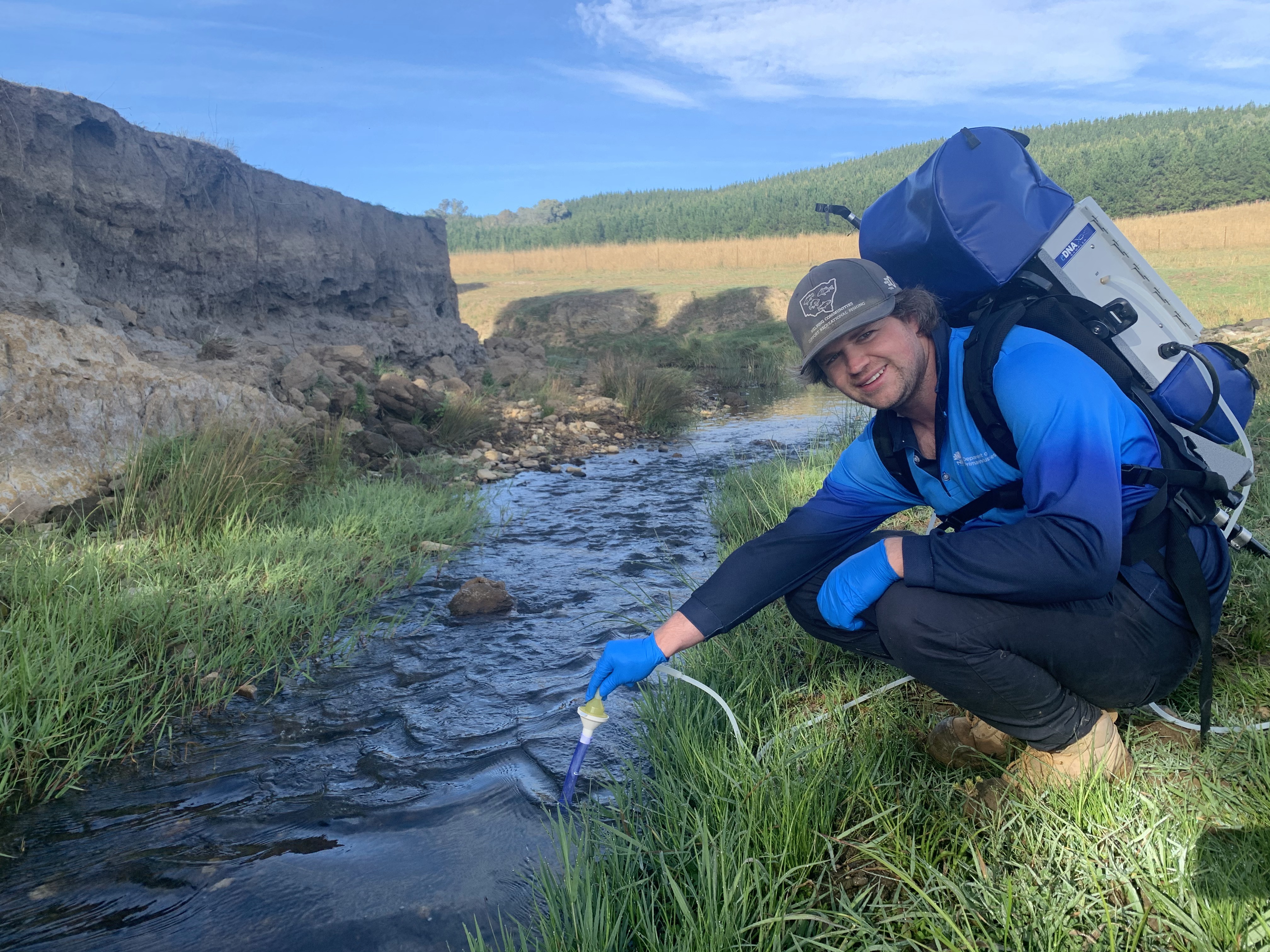 Jarrod Chapman collecting water samples using the eDNA backpack in the upper Murrumbidgee River. Source: NSW DPIRD