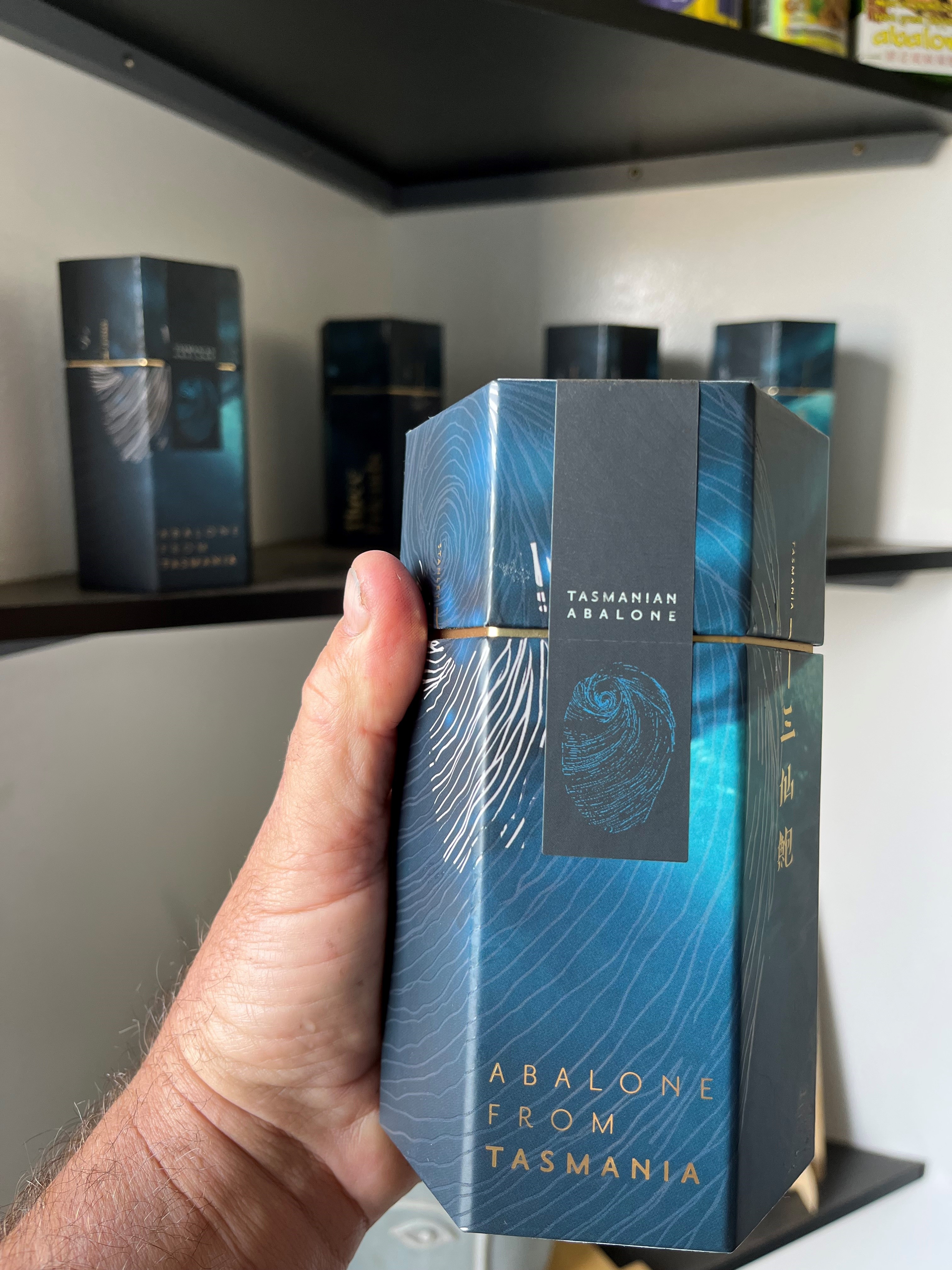 David Maynard holding Three Friends store packaged product