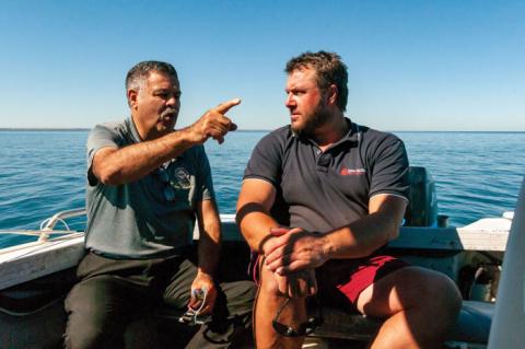 Photo of Klynton Wanganeen and Adam Main on a boat